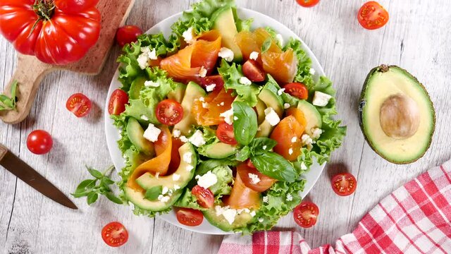 mixed salad with salmon, avocado and basil