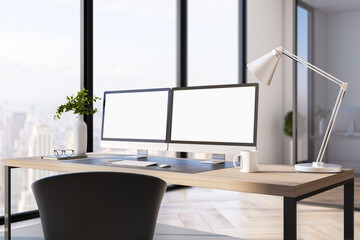Two blank white computer screens on office desktop in interior with daytime city view. Corporate template. Mock up, 3D Rendering.