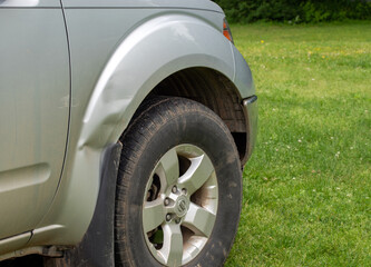 A fender bender accident left minor damage to the passenger side of this silver colored pickup...