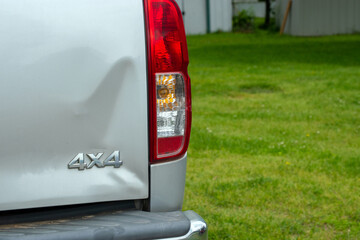 A dented tailgait doesn't hurt the mechanics of this silver colored pickup but does distract from its looks and value. An insurance agent and auto body repair man may be contacted. © Picunique