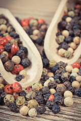 Colored pepper on wooden board. Spice using for cooking