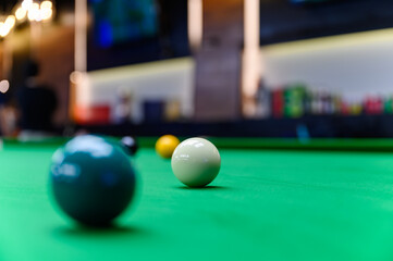 White snooker ball put on green flannel or velvet for ready to play snooker in the club...