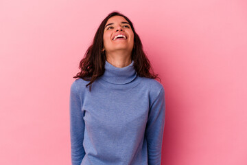 Young caucasian woman isolated on pink background relaxed and happy laughing, neck stretched showing teeth.