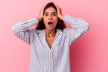 Young caucasian woman isolated on pink background surprised and shocked.