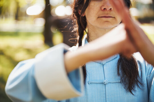 Person Showing Hold Fist Salute Outside In The Park