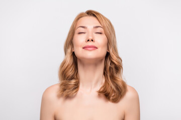 Photo portrait woman with naked shoulders enjoying salon procedures isolated white color background