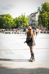 Beautiful country girl in 90s style. Back in time 90s 80s. Stylish girl in retro colourful vintage coat. dressed in street style clothes with chains around neck for a walk. Youth and lifestyle concept