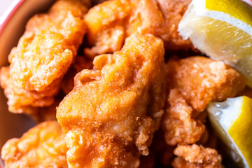 Breaded crispy fried chicken drumctick in the basket