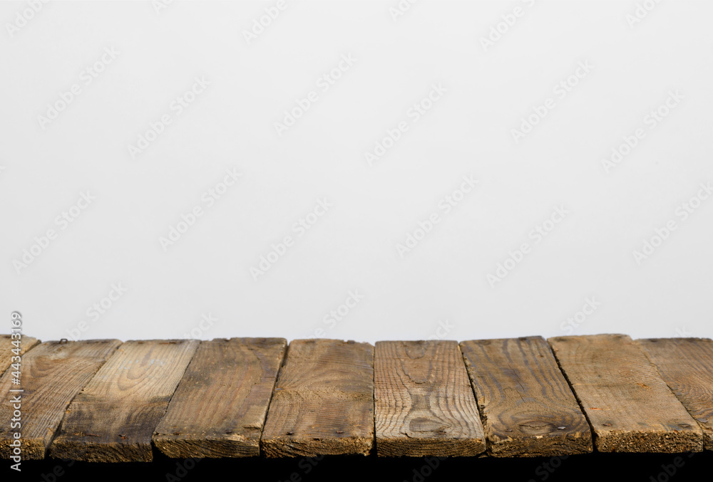 Wall mural empty wooden table top from rustic old wood planks, neutral gray background.