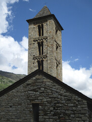 Fototapeta na wymiar UNESCO World Heritage. First Romanesque bell tower of the church in the village of Erill la Vall. (11-12 century). Valley of Boi. Spain.