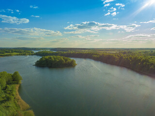 Obraz premium Beautiful aerial landscape on the lake with a drone. Many lake islands covered with forests, fields on a sunny day