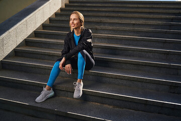 Cheerful female enjoying active day in city