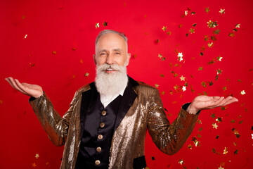 Photo of optimistic beard elder magician man with decoration wear gold jacket isolated on red color...