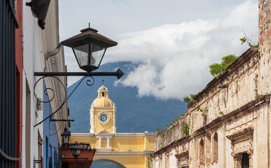 Santa catalina arch with agua volcano in the background at antigua guatemala