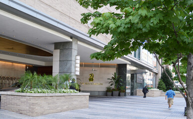 People passing by entrance of The Ritz Carlton Hotel in downtown Washington DC