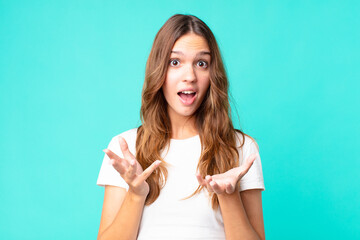young pretty woman feeling extremely shocked and surprised