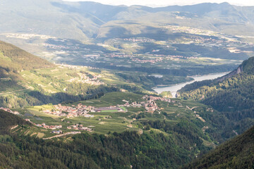 Fototapeta premium The village of Livo and Varollo and the Santa Giustina Lake in Val di Non, Alps, Trentino Alto Adige Südtirol, Italy