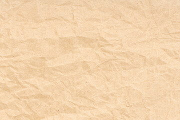 Crumpled paper texture background. Light brown color