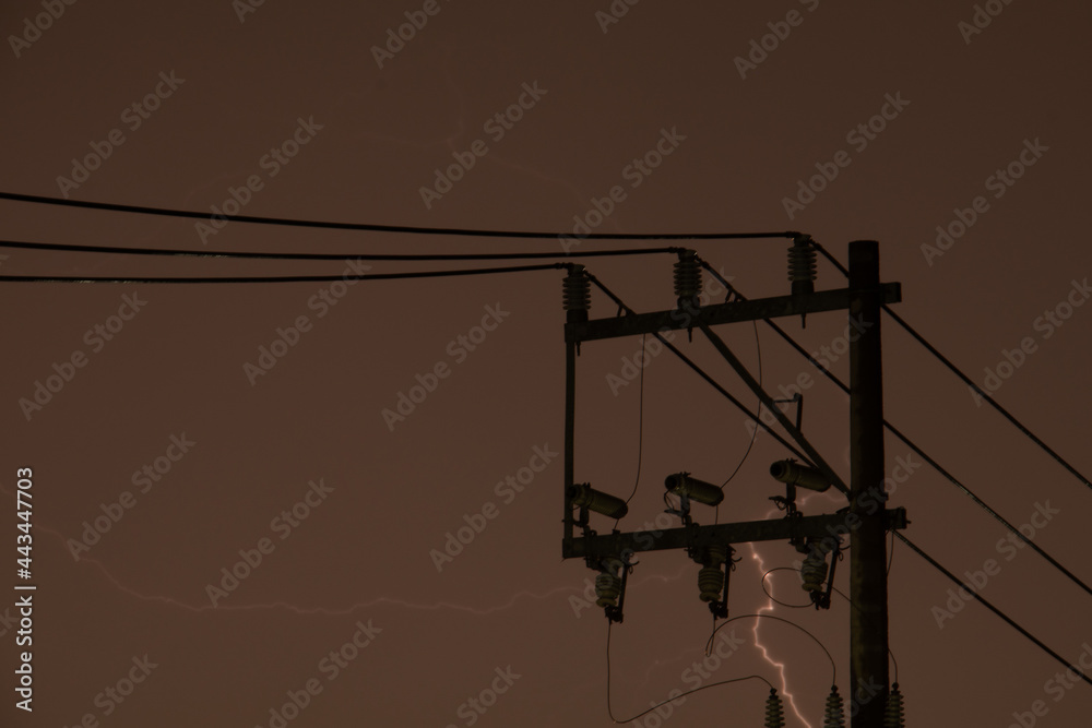 Wall mural thunders near an electric power pole