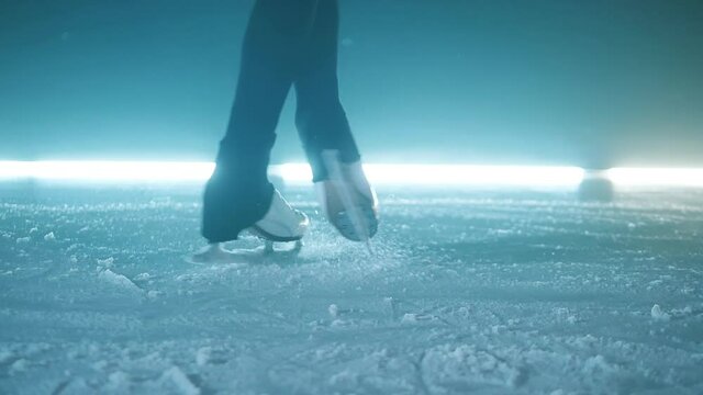 Skater's legs while doing a spinning element in slow motion
