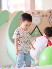 Chinese kids playing on the slide