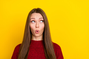 Photo of amazed young shocked woman look empty space reaction news isolated on yellow color background