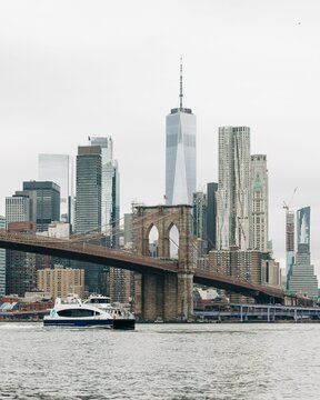 A ferry with the Brooklyn Bridge and Manhattan skyline in the background, from Dumbo, Brooklyn, New York City