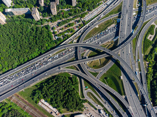 Busy multilevel junction in summer in outskirts