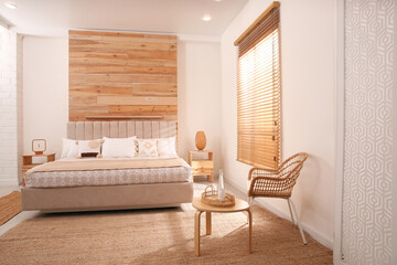 Stylish hotel room interior with comfortable bed