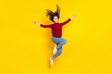 Fototapeta na wymiar Full size photo of young attractive woman happy positive smile jump active isolated over yellow color background