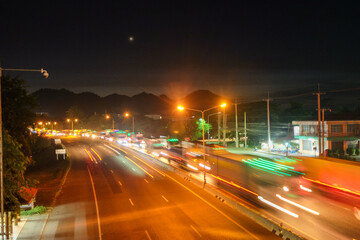 Fototapeta na wymiar Traffic on the highway at night