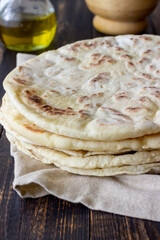 Pita bread on a wooden background. National cuisine. Healthy eating. Vegetarian food.