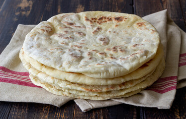 Pita bread on a wooden background. National cuisine. Healthy eating. Vegetarian food.