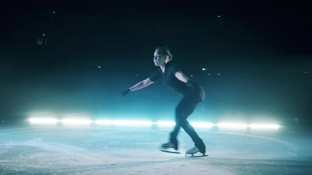 Slow motion of a figure skater doing a single jump