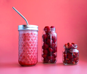 berry smoothie, and strawberry berries on a red background