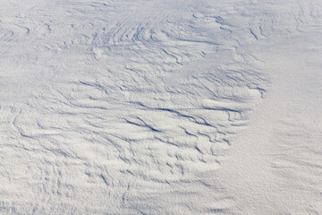 Snow drifts in winter - the territory covered with snow in the winter season. Photo taken in close-up