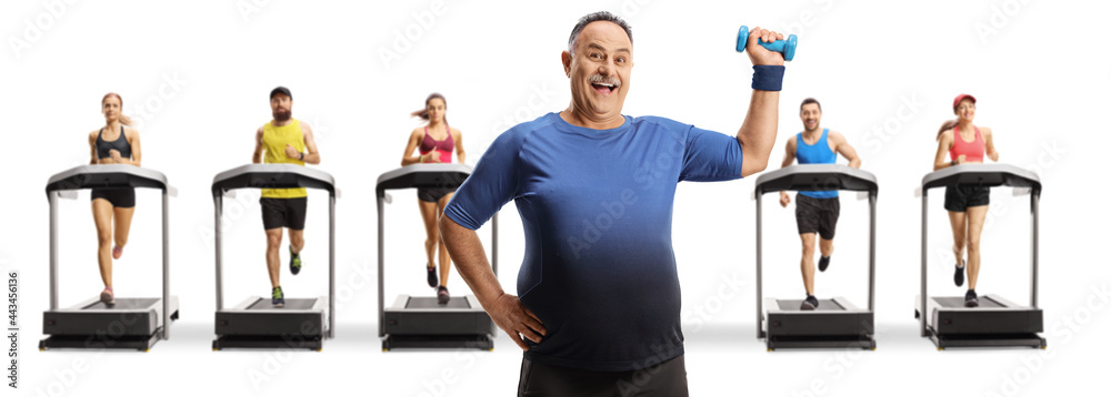 Canvas Prints Mature man with dumbbells in a gym with treadmills and people running