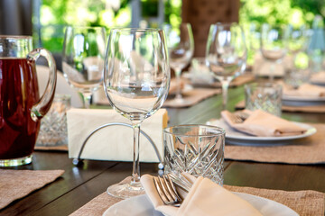 Empty wine glasses are on the table. A fragment of the serving.
