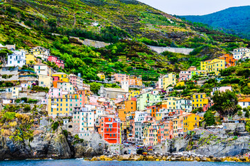 Fototapeta na wymiar Views of the city of Riomaggiore from the boat, one of the Cinque Terre villages, La Spezia, Liguria-Italy