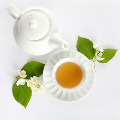 cup of tea with jasmine flowers on white background. Flat lay, top view