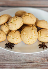 
There is a bowl of delicious cookies on the table.