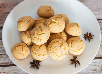 
There is a bowl of delicious cookies on the table.