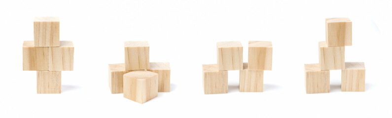 Four geometric wooden cube blocks stacked  isolated