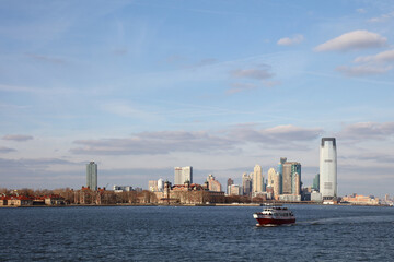 Fototapeta premium Ellis Island mit Jersey City Skyline / Ellis Island with Jersey City Skyline /