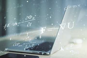 Double exposure of creative scientific formula concept on laptop background, research and...
