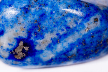 Macro mineral stone blue lapis lazuli (afghanistan) on white background