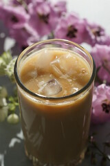 Iced coffee with ice in a tall glass