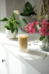 Iced coffee with ice in a tall glass