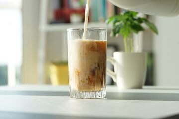 Iced coffee with ice in a tall glass