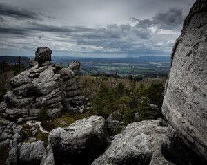  Table Mountains range in Poland. Cloudy sky, grey sandstone rock formations. 
